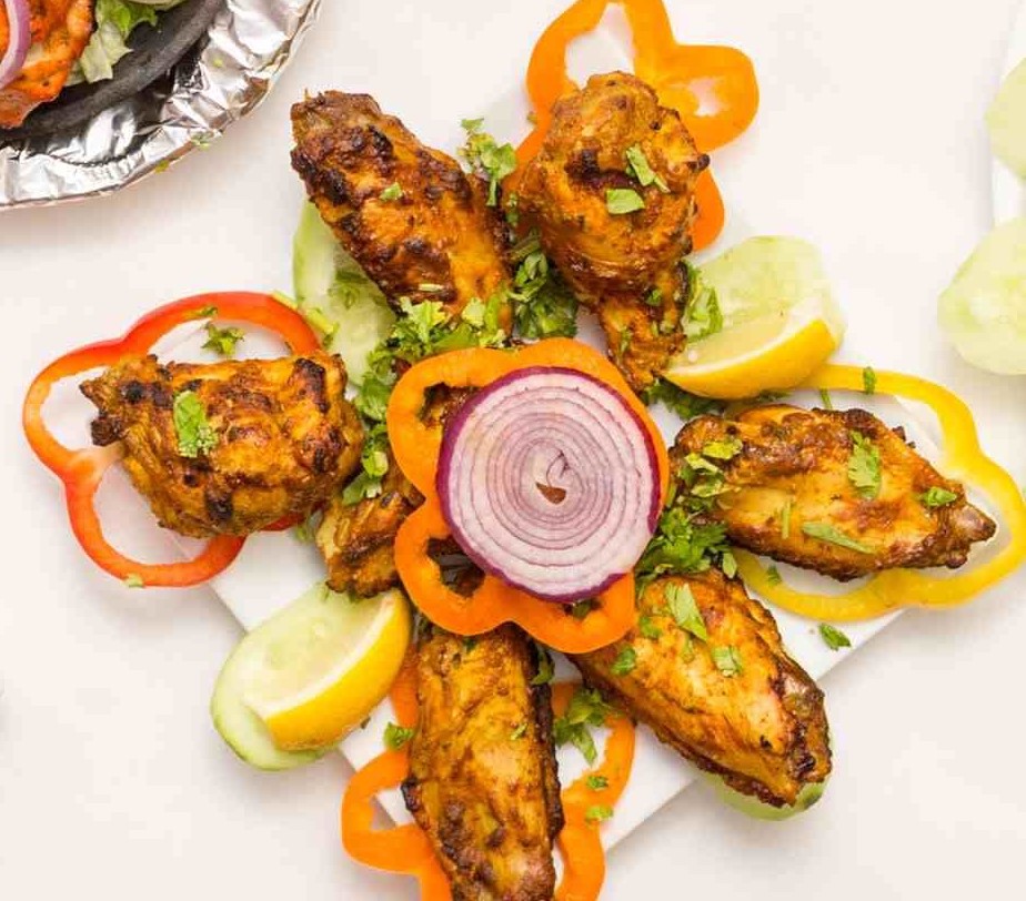 Marinated chicken wings grilled in the clay oven known as tandoor