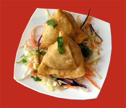 The most popular snack of India. Punjabi spiced potato and peas stuffed in a triangular crispy pastry shell